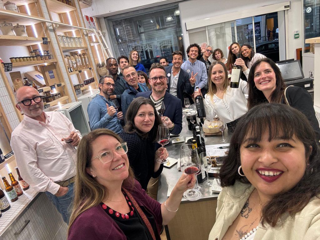 Team enjoying a speed tasting team building with Wine with Jasmina in Paris